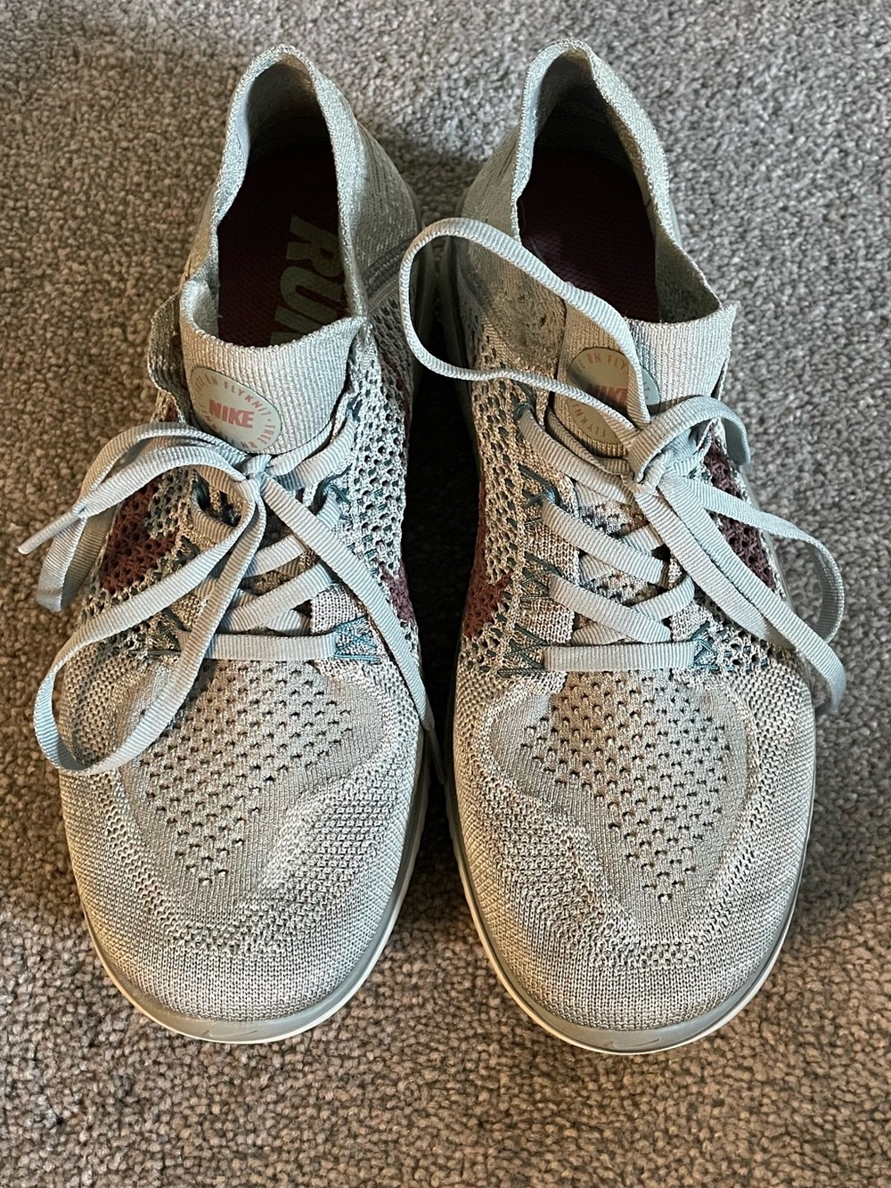 Nike Light Gray Flyknit Sneakers with Rust Accents